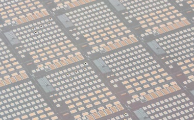 Integration of InP DFB lasers onto silicon photonics wafer