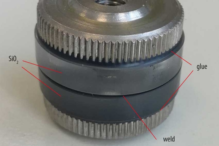 Welded fused silica sub- strates glued to knurled nuts for tensile testing....