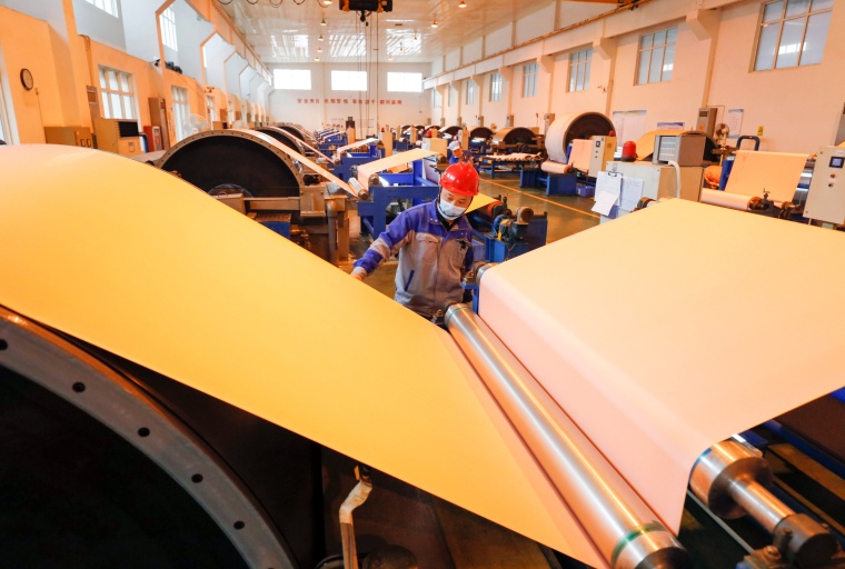 Workers on a copper foil production line for electronic lithium batteries....