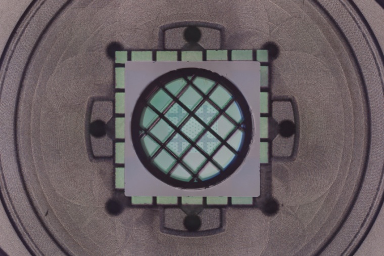 The crystal-like cavity mirrors with the drum in the middle. (Source: G. Huang,...