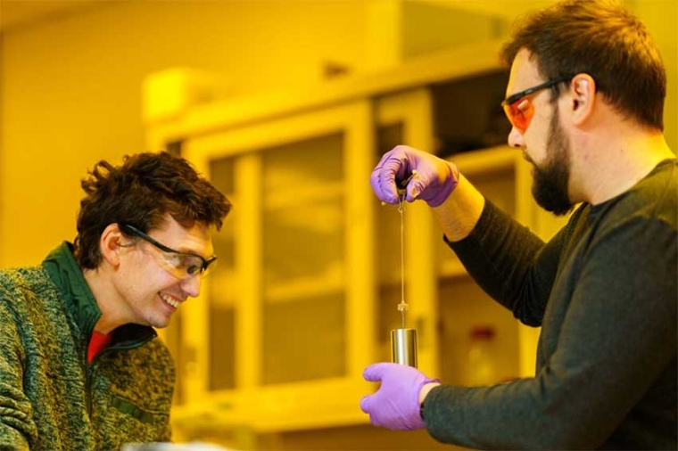 Samuel Leguizamon, left, watches as Alex Commisso stretches 3D material that...