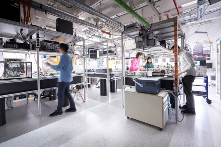 Nathalie Picqué and some of her team members in one of her dual comb labs....