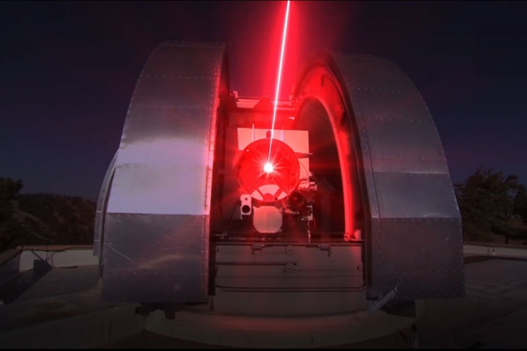 Optical ground station shooting laser light to a relay satellite (Source: Nasa)