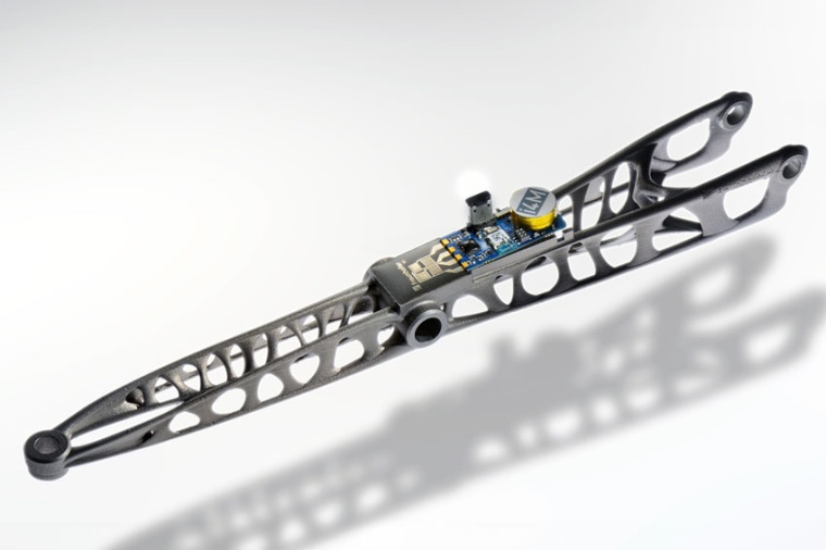 A car control arm with imprinted force sensor measures the forces acting during...