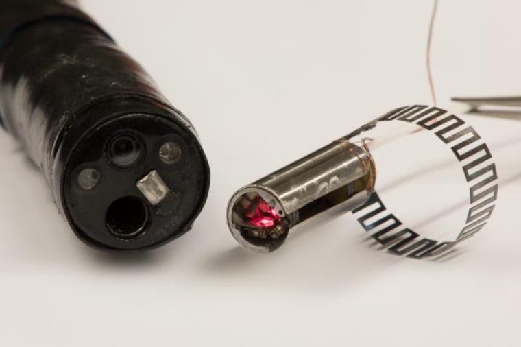 The microrobotic laser-steering end-effector can be used as a fitted add-on...