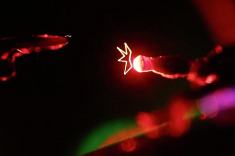 Lasers are used to create a holographic displays of science fiction, inspired...