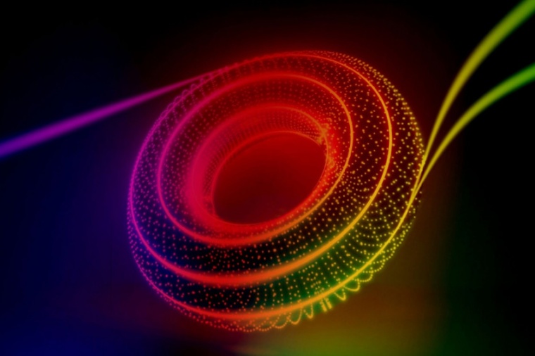 This image artistically combines the journey of twin particles of light along...
