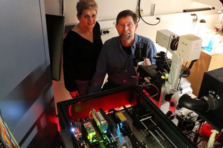 Drs Catherine and Jim Galbraith with one of their microscopes (Source: OHSU,...