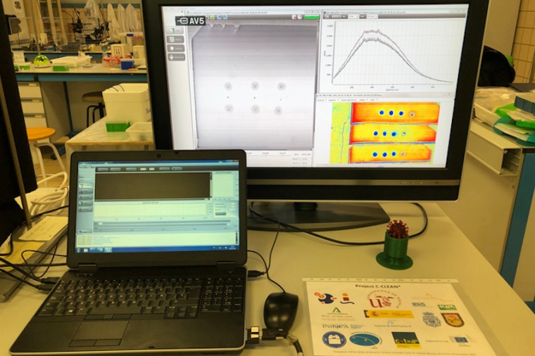 The grayscale image shows fluid droplets with and without viruses. (Source: U....