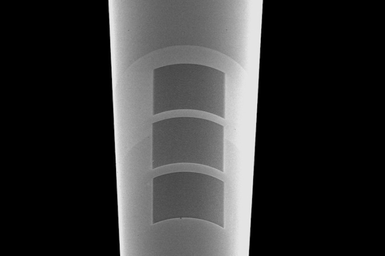 A tapered optical fiber equipped with nanostructures that resonate in response...