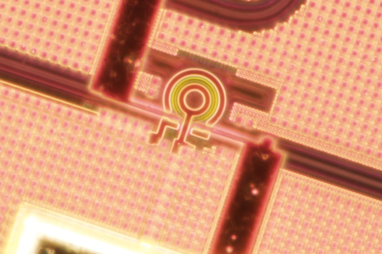 Photonic chip with a microring resonator nanofabricated in a commercial...