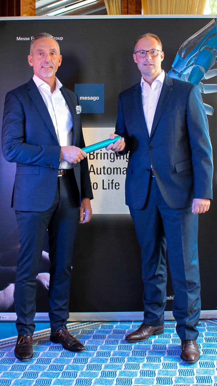 Christian Wolf (right), Managing Director of Hans Turck GmbH & Co. KG, hands...