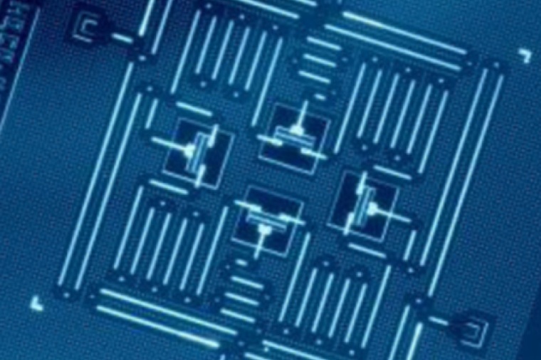 A quantum computer chip designed by IBM that includes four superconducting...