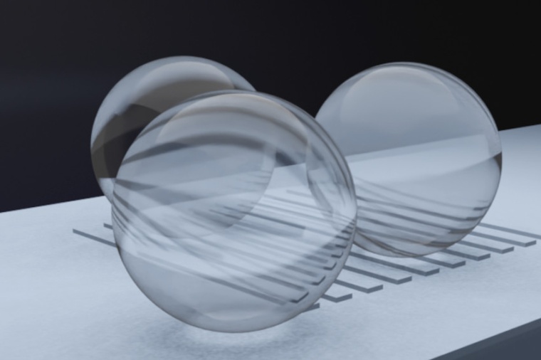 Microspheres placed on a specimen in an inter­ference microscope setup enable...