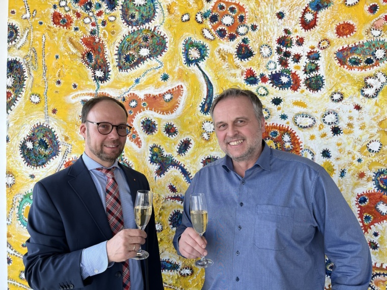 Lothar Zimmer, CEO of ifm (left) and Christoph Müllner, former shareholder of...