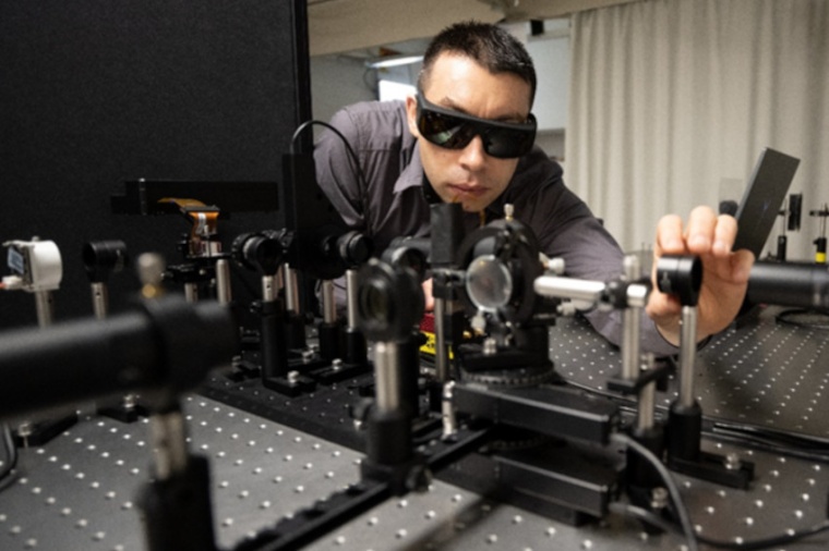 Augusto Arias-Gallego working on the setup that was used to measure the...