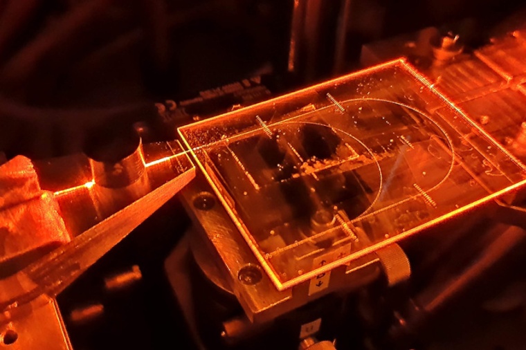 The silica-based QKD receiver shown consists of a photonic integrated circuit...