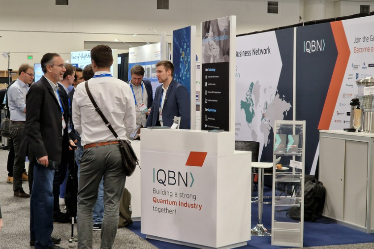 Some members at the QBN booth in conversation with visitors. (Source: QBN)