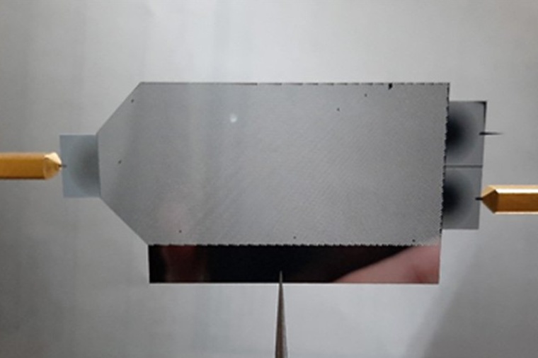 Experimental set-up to manipulate the behavior of light with photonic crystals....