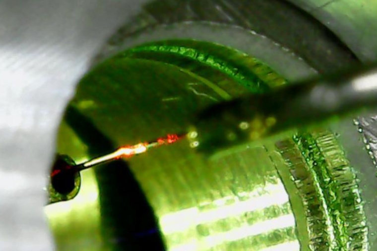 A close up of the fiber approaching the mirror to form the cavity. (Source: E....